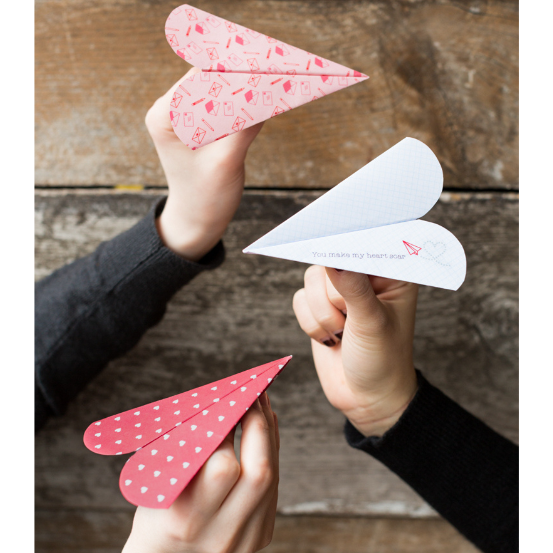 Heart-shaped paper airplanes
