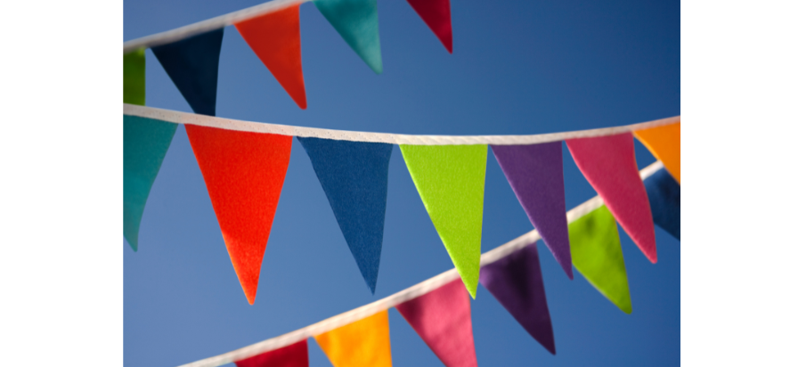 Fabric triangles hung across sky to represent bunting sewing technique.