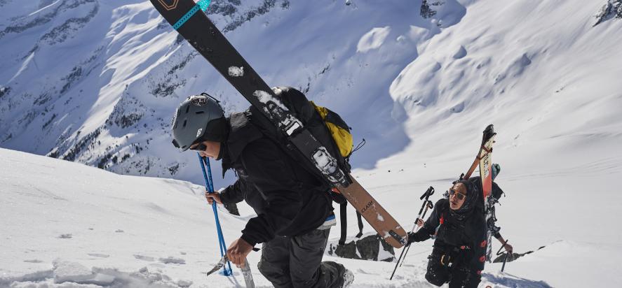 Skiers climbing