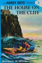 Book cover of the young Hardy boys in a boat in the sea next to a cliff with a house on top. Text reads the house on the cliff by Franklin W. Dixon