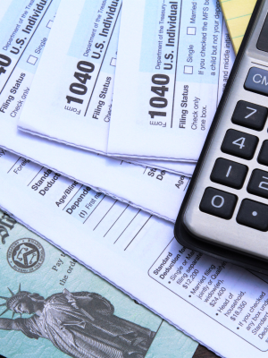 Photo of 1040 tax documents and calculator
