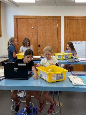 the girls who code club members during a club meeting